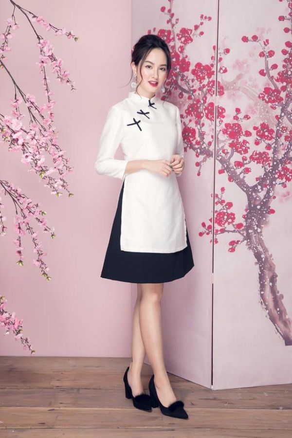 Áo dài nữ cách tân với tà áo dài đến đầu gối và tay áo lửng trẻ trung và hiện đại