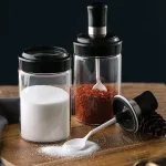 Combo 5 Hũ Đựng Gia Vị Bằng Thuỷ Tinh - Lọ Đựng Gia Vị Thuỷ Tinh Có Nắp Đậy Kèm Thìa Nhà Bếp 13x5cm
