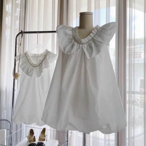Đầm doll trắng cổ sen viền đá