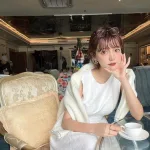 Đầm midi trắng khoét lưng tim