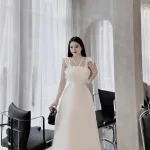 Đầm phối hoa xếp ngực form dài