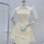 Đầm ren lưới ô cổ viền đá tùng xoè đính hoa ngọc