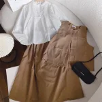 Sét 3 món áo trắng xếp li ngực phối ghi lê nâu túi + chân váy midi
