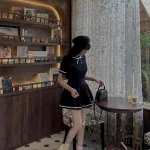 Sét áo cổ cao viền thắt nơ + chân váy xếp ly