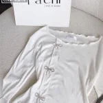 Sét áo trắng cuốn biên cài đá nơ + chân váy midi nude